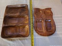 Front view of both trays with tape measure for scale