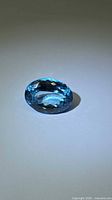 Front angled view of the oval Swiss blue topaz showing overall shape and brilliance