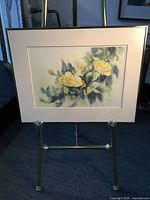 Full view of framed watercolor on easel