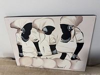 Front view of painting showing three abstract figures in neutral palette