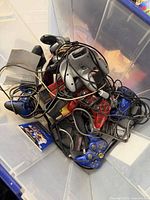 Mixed controllers piled in clear bin