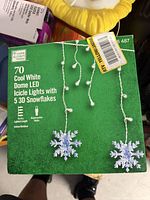 Front of green retail box displaying product details