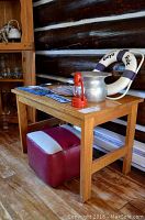Photo of wooden table with decor and stool showing overall setup