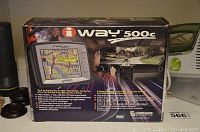 Box of Lowrance iWay 500c GPS system showing front panel with color map display and features.