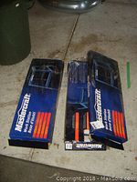 Three Mastercraft work station bases in original blue boxes, placed on a concrete floor, showing packaging and branding.