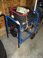 Front side of generator with extension cord coiled on top