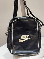Front view showing Nike logo, white piping, overall style
