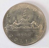 Reverse side showing Voyageur canoe design and 1969 date