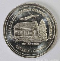 Obverse showing log cabin design and inscriptions