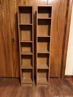 Front view of both bookcases displaying overall design and condition