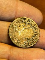 Reverse showing denomination ONE QUARTER ANNA 1862 within wreath