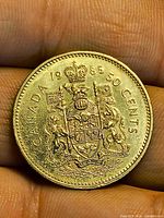 Reverse showing Canadian coat of arms and denomination