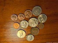 Obverse sides of all twelve coins laid out