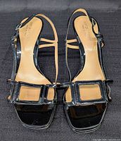 Top view of both sandals showing buckle detail and insoles