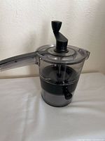 Full view of GEFU Spiralfix spiral slicer showing hand crank and transparent body