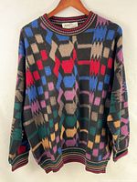 Front view of geometric patterned sweater on hanger