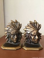 Front view of both bookends showing design and condition
