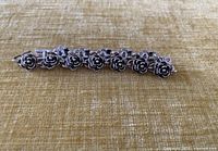 Full view of bracelet showing rose links