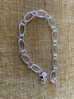 Bracelet arranged in oval to show links and clasp