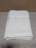 Folded white bath sheet showing overall appearance