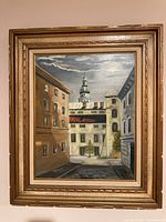 Full view of framed cityscape painting