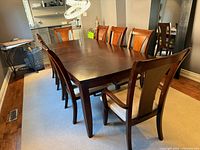 Dining table with eight chairs view one
