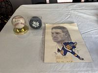 Overall view of signed baseball, signed puck in cube, and Brett Hull print