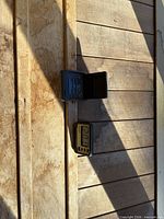Both digital clocks positioned on wooden surface