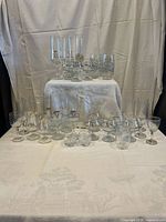 Full lot showing assorted glassware on two tiers
