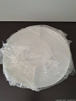 Top view of plate wrapped in bubble wrap