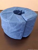 Angled view showing blue donut pillow and front slit