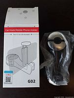 Front of retail box with sealed phone holder