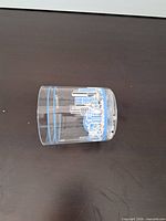 Side view of acrylic tumbler showing skyline graphic