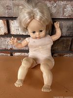 Front view of vintage blonde sleep-eye baby doll