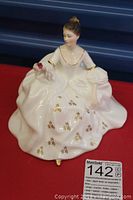 Front view of the Royal Doulton 'My Love' HN 2339 figurine showing detailed face, white gown with gold floral accents, and hand holding a pink rose.