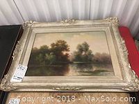 Front view of framed oil painting showing full landscape scene and frame