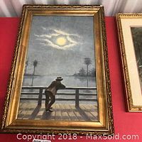 Full frontal view of the framed painting showing the figure on the railing under moonlight