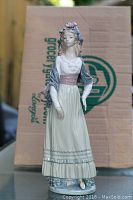 Front view of entire figurine showing dress and stance