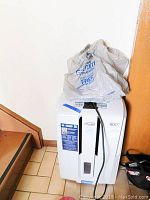 Front view showing overall condition with plastic bag on top