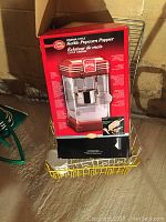 Original boxed Betty Crocker Cinema-Style Kettle Popcorn Popper showing front and product information.