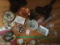 Overall view of the collection showing glass vases, sweet dishes, ceramic stones, bird decorations, and peacock-themed items.