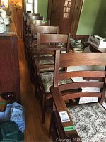 Six chairs in a row, side view