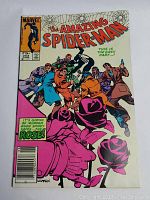 Front cover of The Amazing Spider-Man #253 comic book showing Spider-Man fighting multiple men including the Rose character.