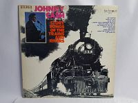 Front cover of Johnny Cash vinyl album 'Story Songs of the Trains and Rivers' showing train and artist image.