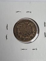 Close-up image of the reverse side of the 1858 USA one cent coin secured in a white 2x2 cardboard coin holder showing the denomination surrounded by wreath and wear consistent with circulated grade.