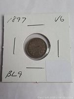 Front view of the 1897 Canada silver five cent coin in a cardboard holder showing coin and handwritten annotations (1897, V6, BL9).