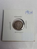 Obverse side of the 1904 Canada silver five cents coin in holder.