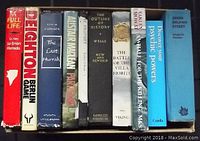 Books lined next to each other showing their spines and titles.