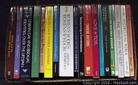 Photo showing fourteen books from the lot standing upright, titles related to women's studies and feminism visible.