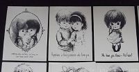 Close-up photo showing 3 oversized black and white 'Moppets' postcards with children and sentimental phrases.
